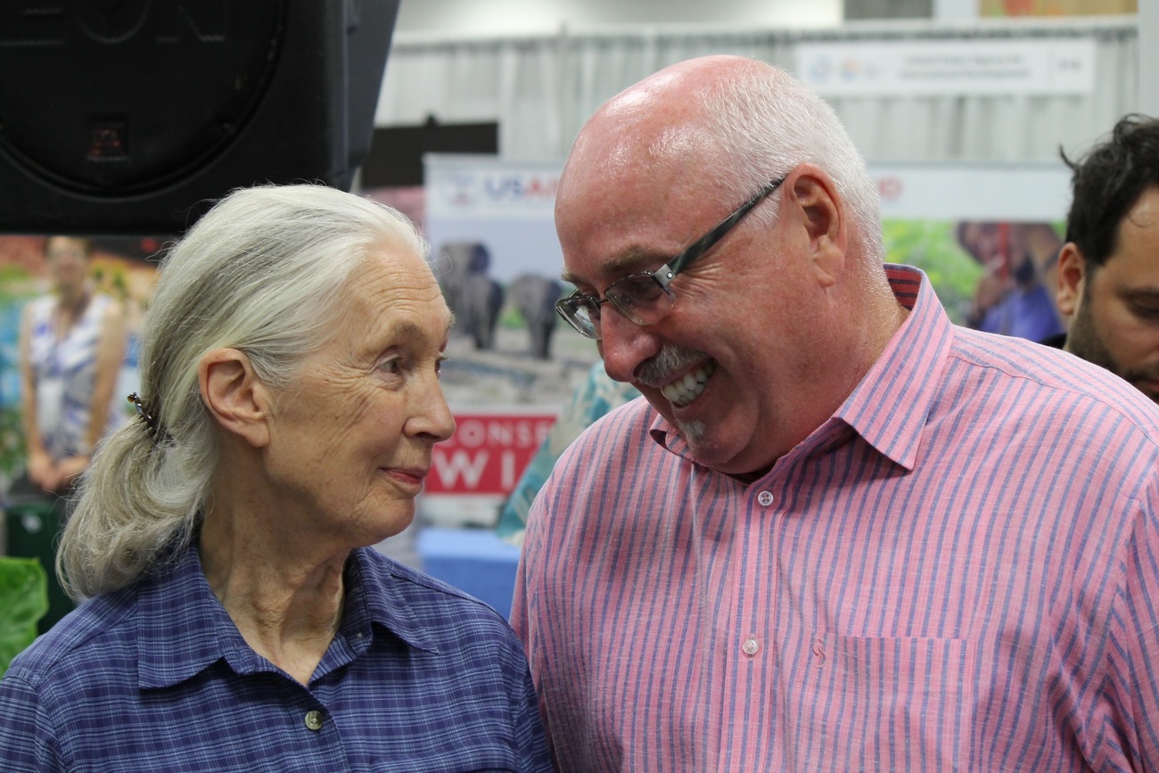 Azzedine Downes smiles while standing with conservation icon Jane Goodall. Downes recently appeared on Goodall's Hopecast podcast. 