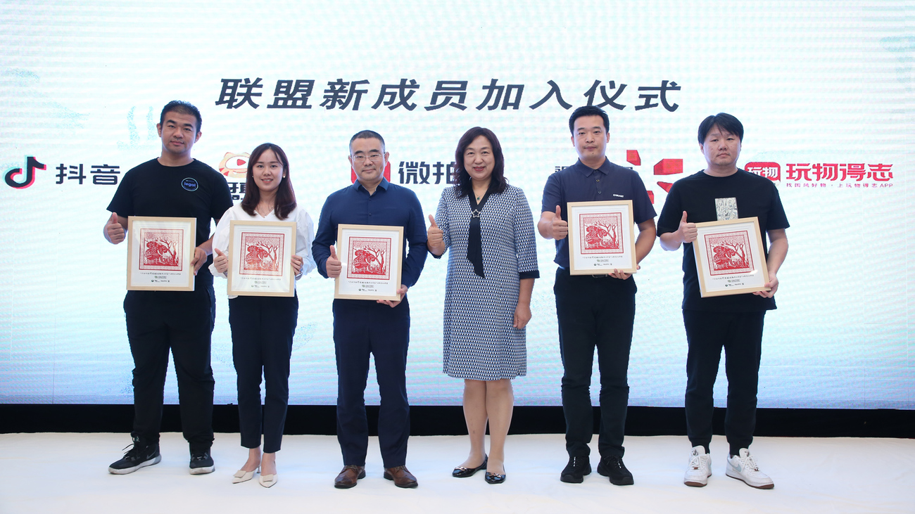 six people in China standing with awards