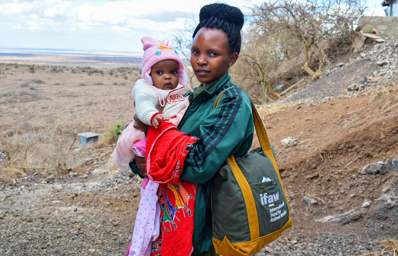 Team Lioness ranger Beatrice Nashipae with six-month old daughter Natalie, who stays with her at the community ranger base in Amboseli.