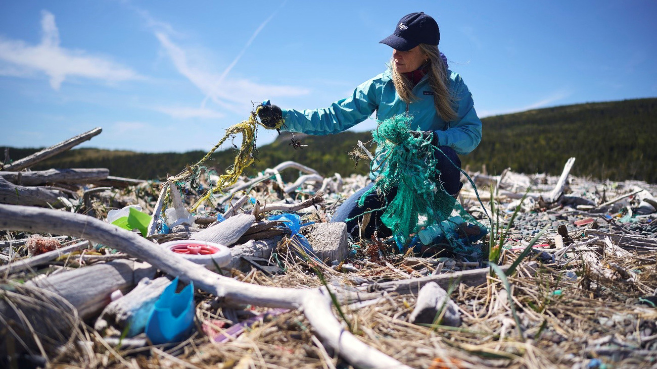 Sheryl Fink, Campaign Director for Canadian Wildlife, helps remove marine debris washed ashore in Newfoundland.