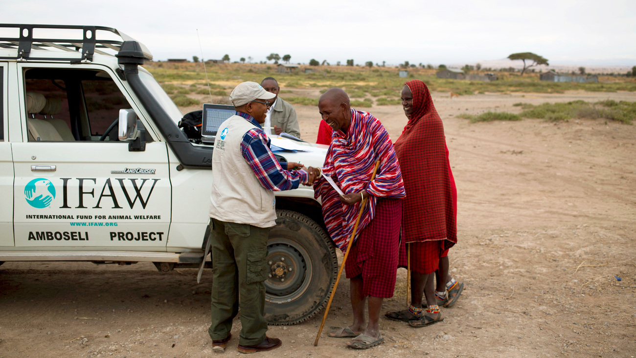 IFAW's Evan Mkala obtains the signature of a local Maasai on the lease of Kitenden Corridor.