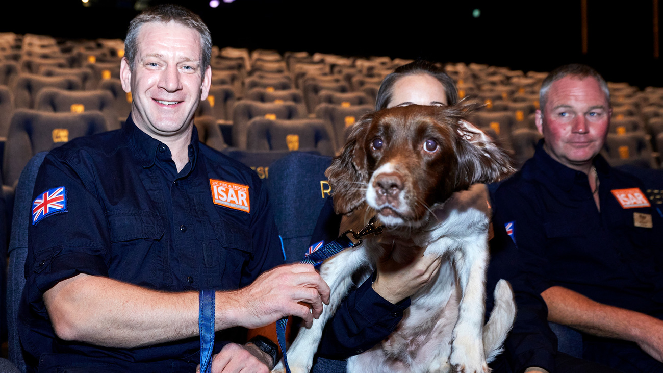 From left: Handlers Dave Hedgecock, Sarah Mimnagh, and Brad Rebbeck with Davey the spaniel at the Animal Action Awards, 17 October 2023.