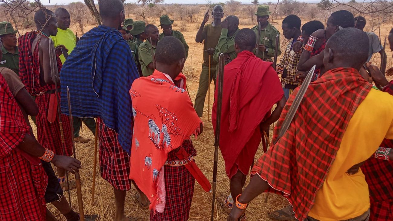 OCWR rangers with local Maasai community members during the rescue of two days-old lion cubs found without their mother.