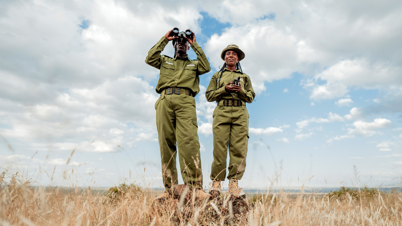 Wilson Kosianka and Team Lioness' Eunice Peneti, Olgulului Community Wildlife Rangers, surveying the landscape while on patrol in Amboseli, Kenya.