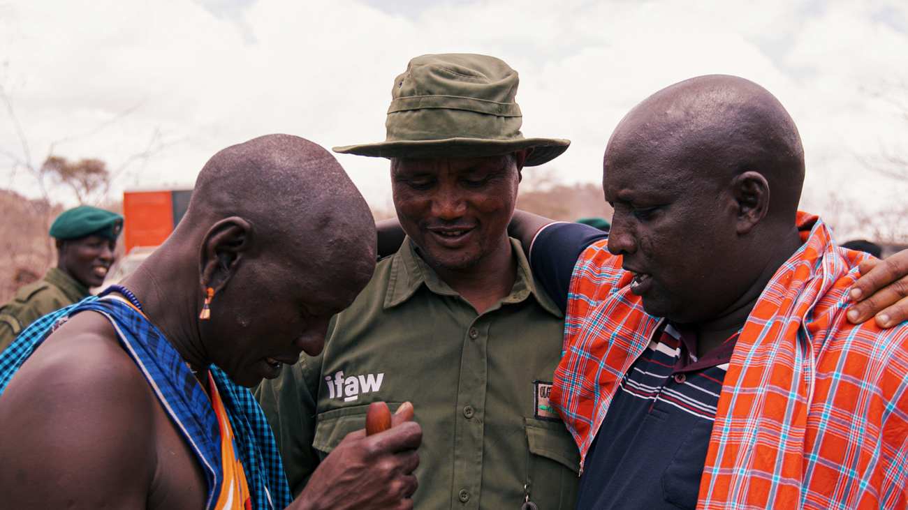 An OCWR ranger with other Maasai community members, Amboseli, Kenya.