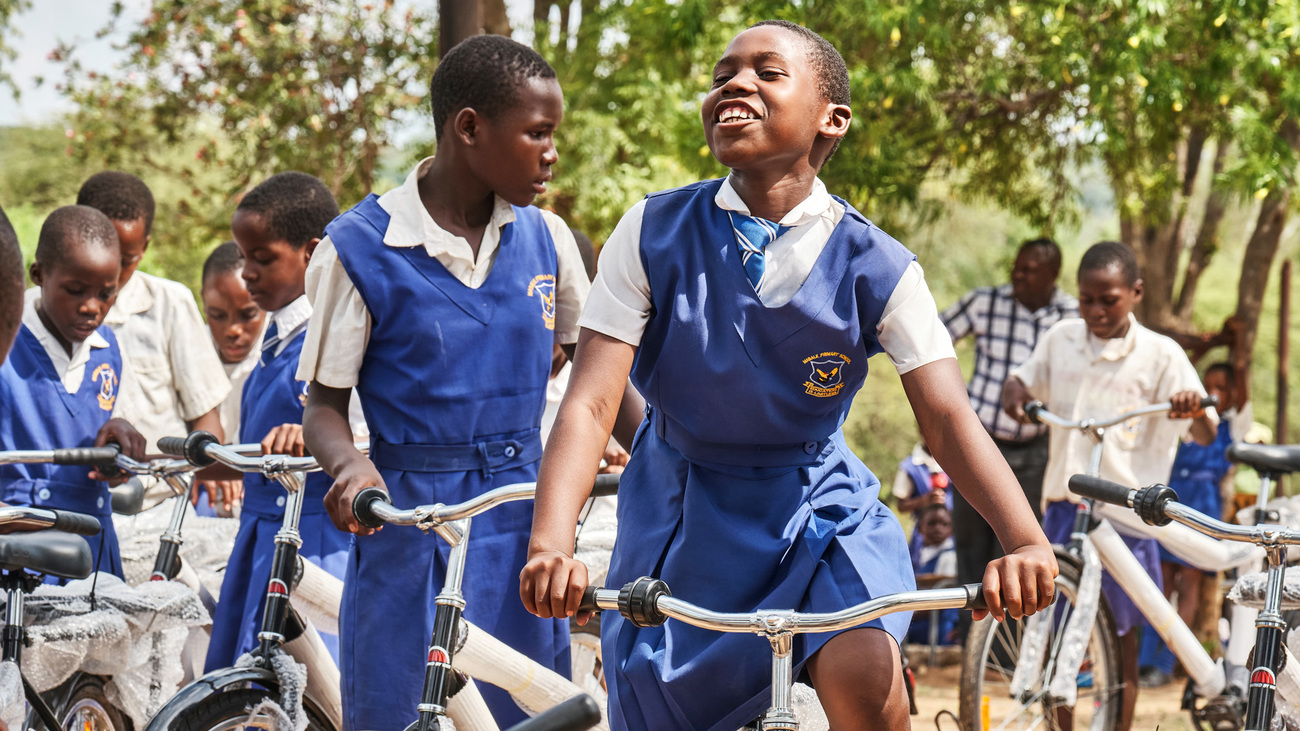 Bicycle recipients express their joy after receiving bicycles during a handover event held at Mabale Primary School in Hwange, Zimbabwe.