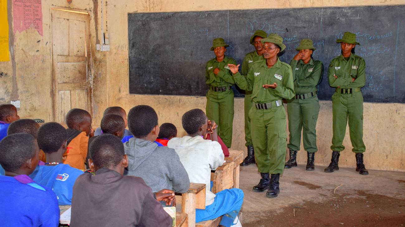 Team Lioness Ranger Purity Lakara speaking to students at Engong Narok Primary School in Amboseli.