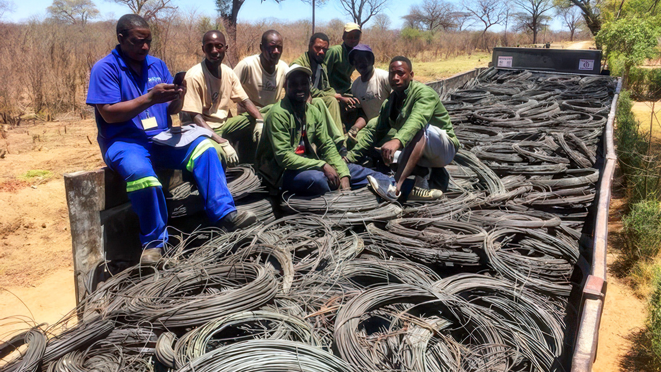 The DART team with 26 tonnes of phone wire snares they removed from the border of Hwange National Park.