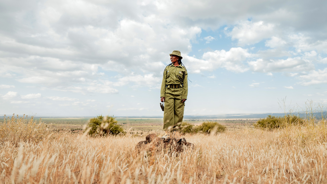 Team Lioness' Eunice Peneti surveying the landscape while on patrol in Amboseli, Kenya.