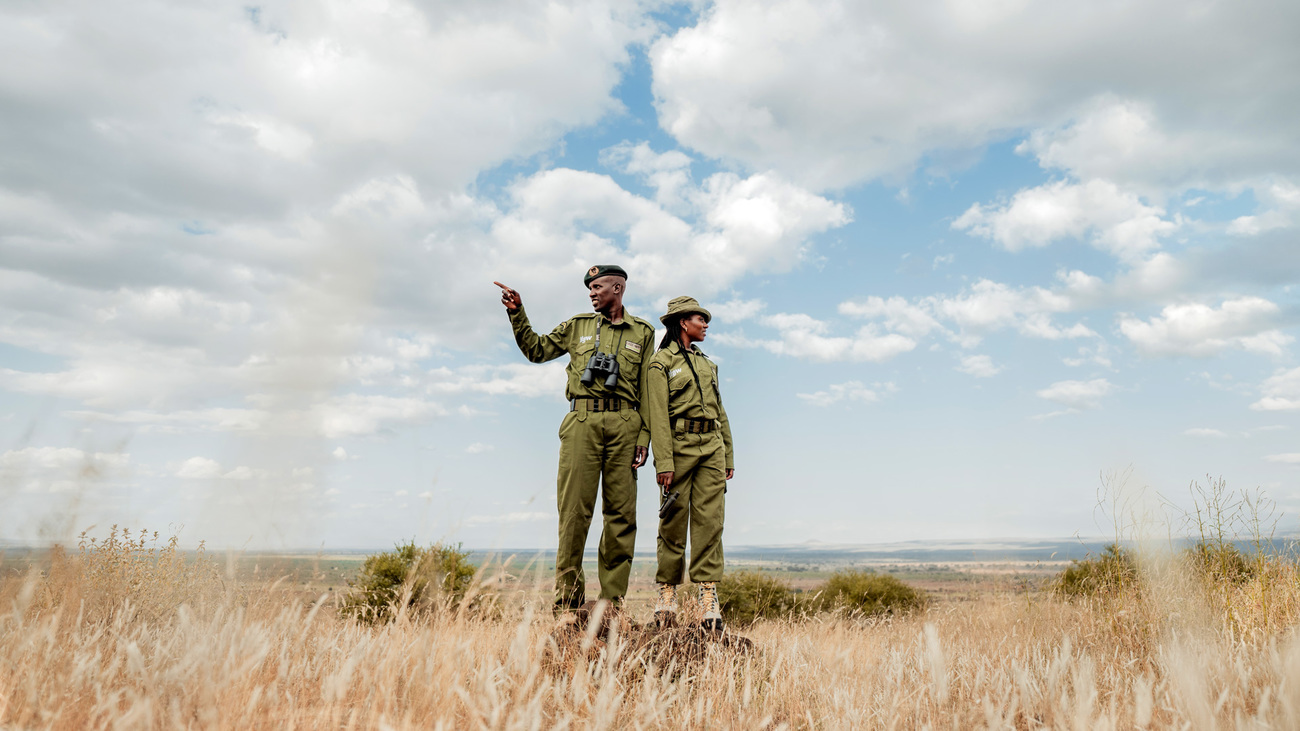 Wilson Kosianka and Team Lioness' Eunice Peneti, Olgulului Community Wildlife Rangers, surveying the landscape while on patrol in Amboseli, Kenya.