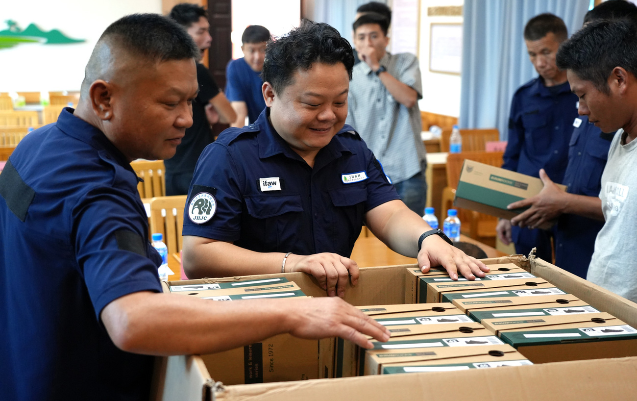 Community rangers receiving donated field equipment during the training workshop in Xishuangbanna, Yunnan Province.