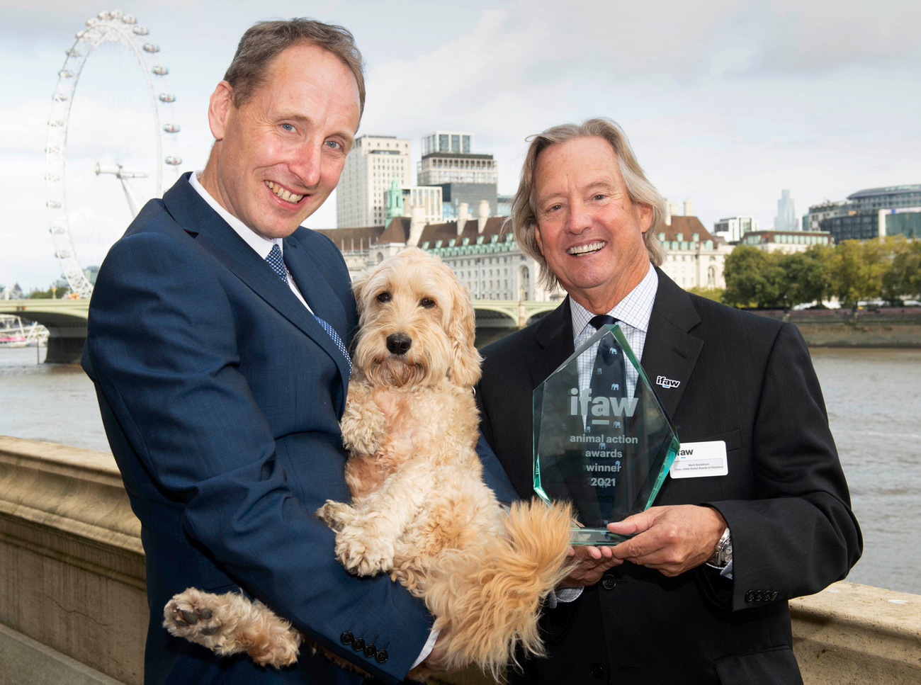 Jasper our Animal of the Year 2021 with his owner David Anderson, and Mark Beaudouin, Chairman of IFAW’s Global Boards of Directors.