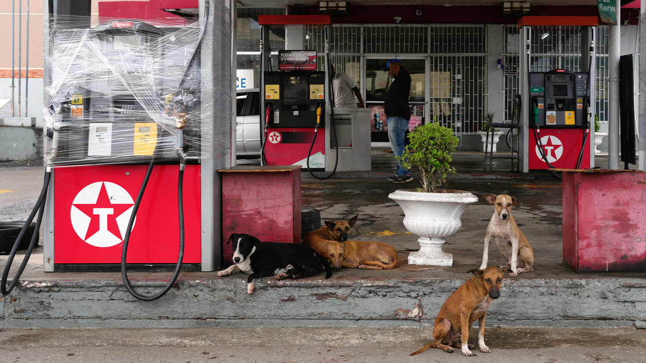 Fuel pumps are covered in plastic at a gas station ahead of the arrival of Hurricane Melissa in Kingston, Jamaica, Sunday, 26 October 2025.