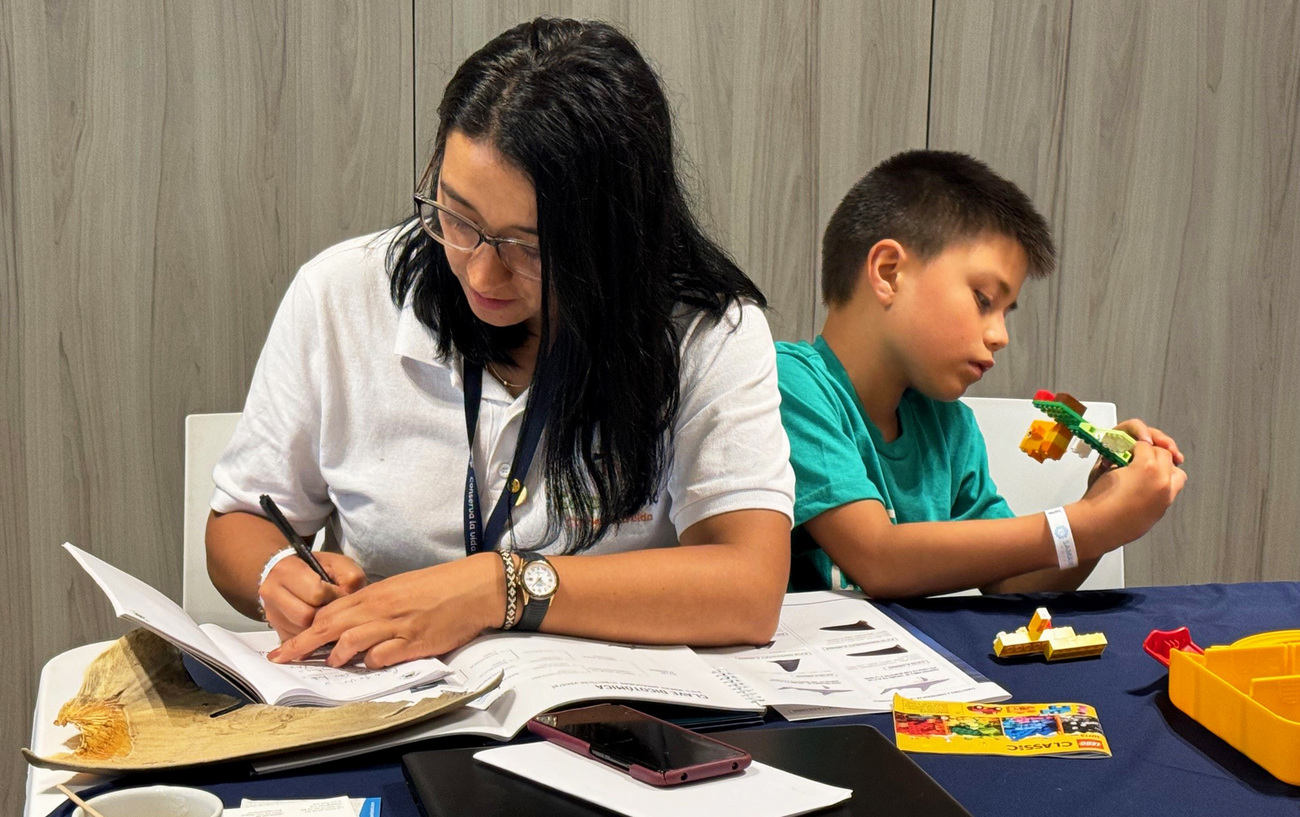 Angela at the shark fin identification workshop accompanied by her son, Manuel.