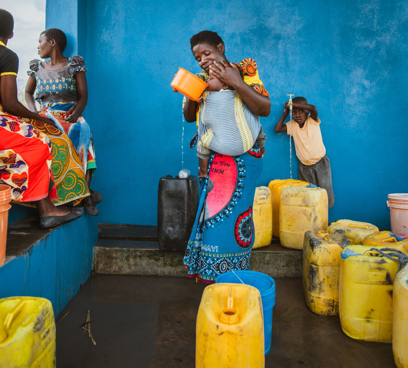 People at water station in Chikolongo Community, Liwonde National Park, Malawi