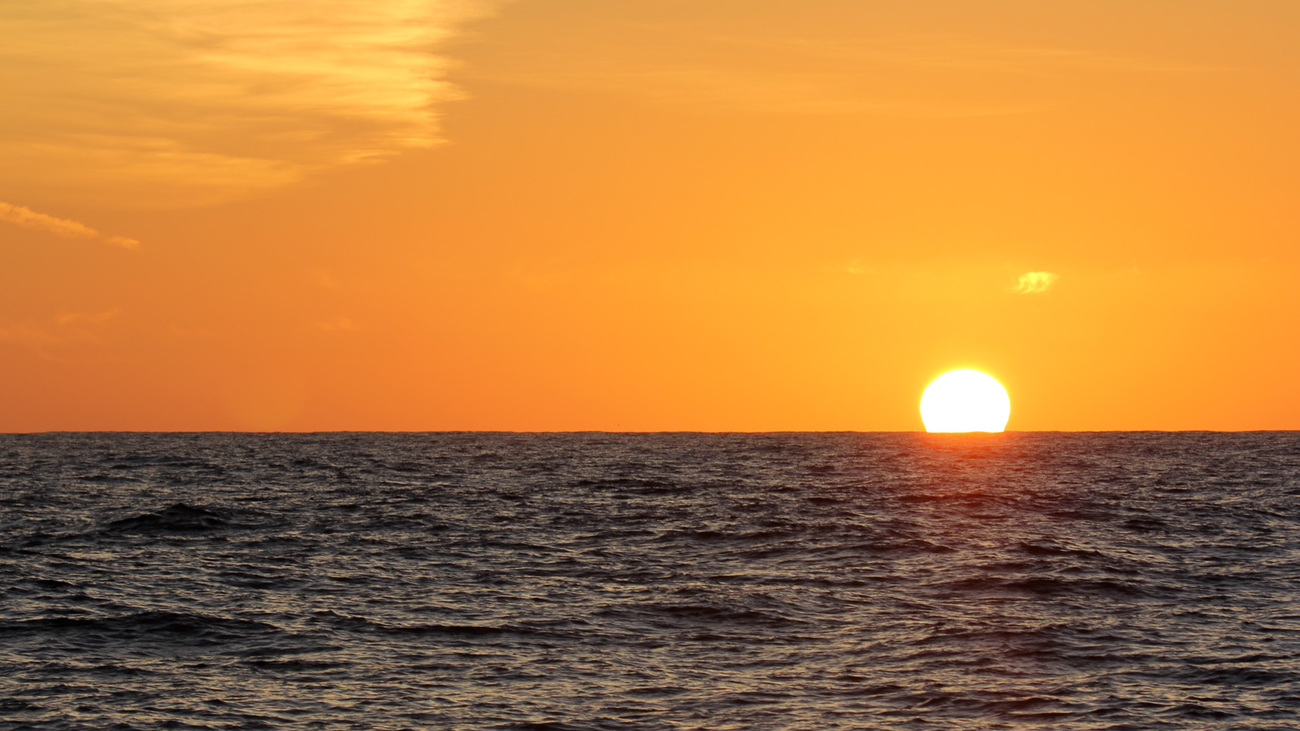 Sun setting on the horizon.
