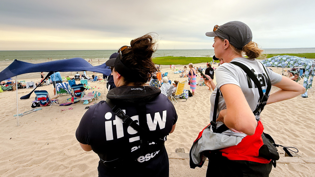 IFAW marine mammal experts and volunteers monitored the long stretch of coastline from Wellfleet to Dennis, MA on day two of the response, while boat teams worked to guide the dolphins toward deeper water. [same credit]