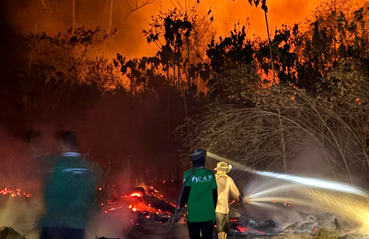 Conservation Action Network team members work to suppress forest fires in Indonesian Borneo, helping protect wildlife habitat and nearby communities.