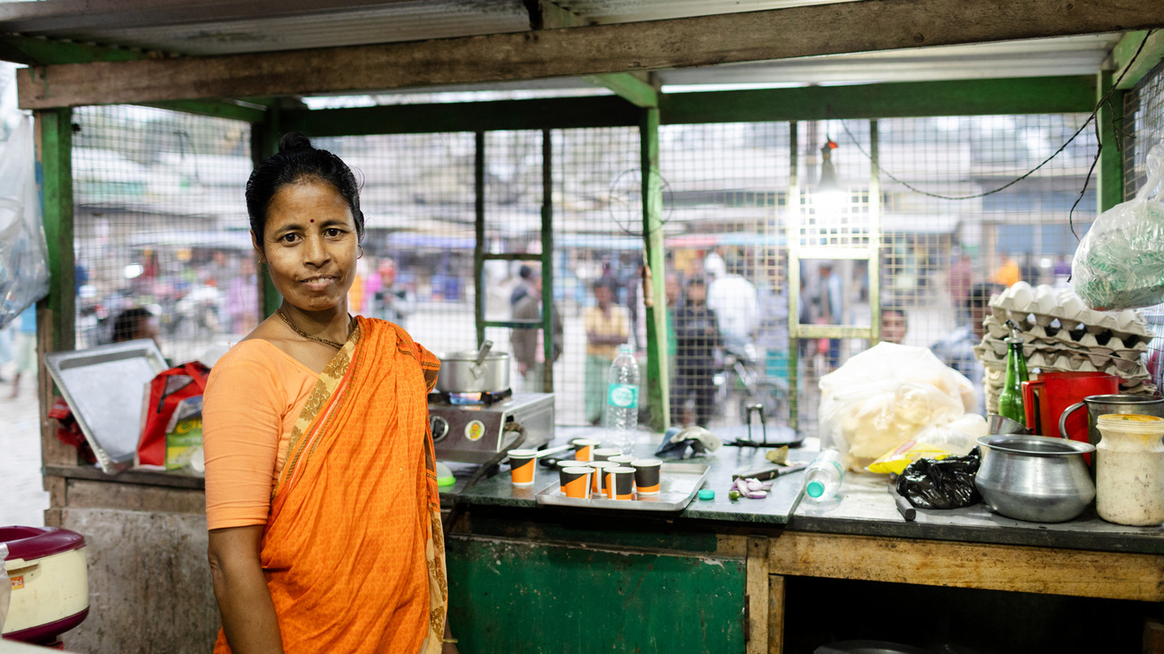 A participant in the Green Restaurant Program, one of six community restaurants managed by local women to build greater financial independence while supporting families living alongside tiger habitat.