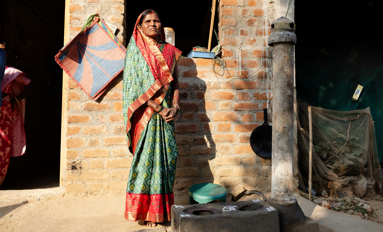 A woman living near the Nawegaon-Nagzira Tiger Reserve demonstrates an improved cookstove