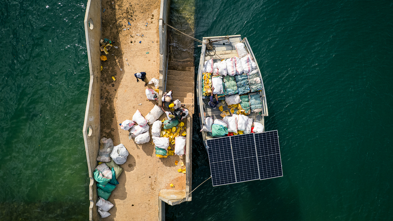 An aerial view shows Flipflopi's recycled-plastic barge beside Mtangawanda jetty on Pate Island, Kenya.