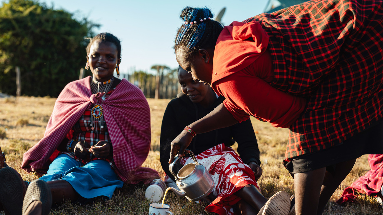 Representatives from eight IFAW-supported women’s groups in Loita drink tea together